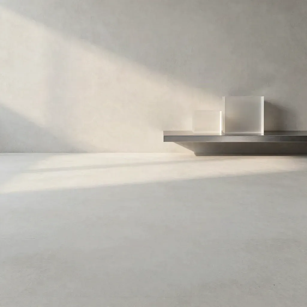Pale concrete and plaster backdrop with brushed metal accents, open space for pricing copy.